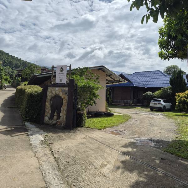 The gate and sign at the entrance to SuperBee HQ in Ban Pong, Hang Dong