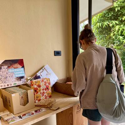 A visitor at the gift counter by the showroom window