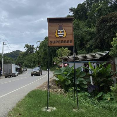 The SuperBee sign at the roadside in Mae Ha, Hang Dong