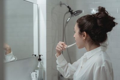 Woman brushing her teeth